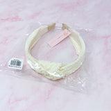 Bandeau élégant orné de perles et nœud