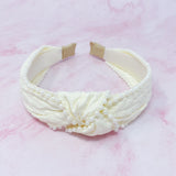 Bandeau élégant orné de perles et nœud