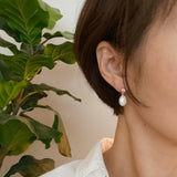 Boucles d'oreilles pendantes élégantes en perles d'eau douce