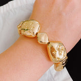 Bracelet extensible avec galets dorés Starlight