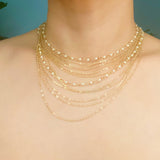 Collar de cadena y perlas bellamente drapeado