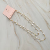Collier à longue chaîne en forme de cœur et de perles