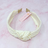 Bandeau élégant orné de perles et nœud
