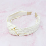 Bandeau élégant orné de perles et nœud