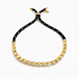 Adjustable rope-style tennis bracelet featuring round bezel-set cubic zirconia stones, offering a modern blend of shimmer and sporty sophistication.