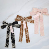 Stylish bow hair clip featuring decorative contrast stitching and a structured design—adding a touch of handcrafted charm and elegance to any hairstyle.