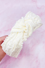 Bandeau élégant orné de perles et nœud