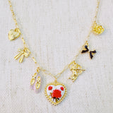 Gold-tone charm necklace featuring a dreamy mix of rose, ballet shoe, angel, and swan charms—blending grace, romance, and whimsy into a delicate statement piece.