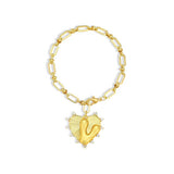 Gold chain bracelet with a heart-shaped charm and initial letter V over the heart charm on a white background