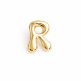 Glossy, balloon-style metal initial brooch pins in a playful, rounded design, available in multiple letters with a puffy, dimensional shape and metallic finish.