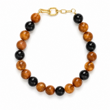 Bracelet with brown and black beads on a white background