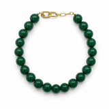 Green beaded bracelet with a gold clasp on a white background