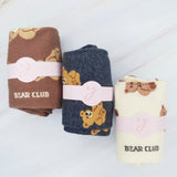 Cute and cozy set of three socks featuring playful bear designs in soft, neutral tones—perfect for adding a touch of whimsy to your everyday look.