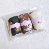 Cute and cozy set of three socks featuring playful bear designs in soft, neutral tones—perfect for adding a touch of whimsy to your everyday look.