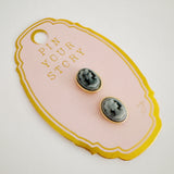 Set of two magnetic brooch pins or earrings featuring a classic black cameo silhouette with an elegant profile design, perfect for adding a vintage-inspired accent to scarves or other styled accessories.