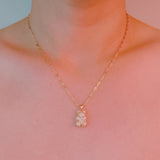 Sparkling gold-tone necklace featuring a playful bear-shaped pendant encrusted with shimmering rhinestones.