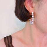 Stylish hoop earrings featuring delicate blue floral accents, offering a fresh and elegant look inspired by nature—ideal for springtime or everyday wear.