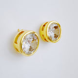 Statement stud earrings featuring bold bezel-set stones, designed to deliver striking sparkle and a sleek, modern silhouette for everyday elegance or special occasions.