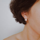 Statement stud earrings featuring bold bezel-set stones, designed to deliver striking sparkle and a sleek, modern silhouette for everyday elegance or special occasions.