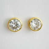 Statement stud earrings featuring bold bezel-set stones, designed to deliver striking sparkle and a sleek, modern silhouette for everyday elegance or special occasions.