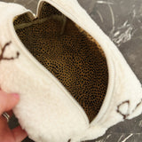 Small fleece zip bag with embroidered fuzzy bows, perfect for cosmetics or travel essentials