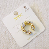 Chunky ear cuff featuring an interwoven braided design in gold and silver tones—delivering a bold, no-piercing look with modern mixed-metal appeal.