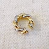 Chunky ear cuff featuring an interwoven braided design in gold and silver tones—delivering a bold, no-piercing look with modern mixed-metal appeal.