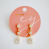 Elegant drop earrings featuring brilliant cubic zirconia stones in a sleek, cascading design, delivering radiant sparkle with every movement for a refined and timeless look.