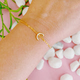 Pulsera con inicial brillante y delicada