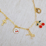 Gold bracelet with cherry, cross, and bow charms– playful Y2K accessory