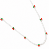 Necklace with red and green bead accents on a white background