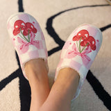 Indoor slippers with a playful cherry print on a soft pink background, round-toe design, available in multiple sizes