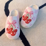 Indoor slippers with a playful cherry print on a soft pink background, round-toe design, available in multiple sizes