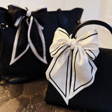 Elegant ribbon-style scarf with contrasting edges, perfect for adding a refined touch to hairstyles, handbag handles, or necklines.