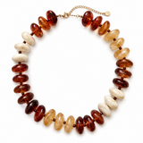 A beaded necklace made of alternating translucent amber-brown and creamy white oval beads, with a gold-tone chain extender and clasp, shown on a plain white background.