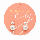 Pearl earrings on a pink Ellison + Young branded card