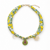 Necklace with lemon and leaf pattern on a white background