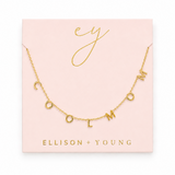 A gold initial necklace spelling 'COOL MOM' displayed on a light pink jewelry card with gold foil lettering. The brand name 'ELLISON + YOUNG' is printed at the bottom of the card.