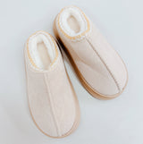 Soft fleece-lined indoor slippers in cream, black, and camel colors with round-toe design, available in multiple sizes