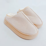 Soft fleece-lined indoor slippers in cream, black, and camel colors with round-toe design, available in multiple sizes