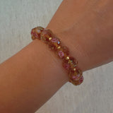Stretch bracelet with faceted beads in white, black, and amber tones – versatile and elegant for layering