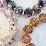 Stretch bracelet with faceted beads in white, black, and amber tones – versatile and elegant for layering