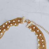 Collar de cadena y perlas bellamente drapeado