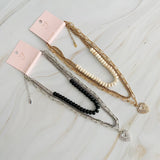 Collier superposé de perles de résine et cœur doré