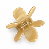 Daisy Claw Clip in ivory marbled acetate, angled view showing the open spring hinge