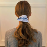 Chic hair scrunchie with a classic preppy design, featuring bold contrasting borders and a tailored look—perfect for polished, everyday styling