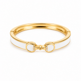 Gold and white bracelet on a white background