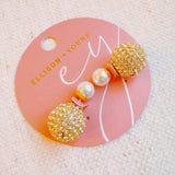 Shiny gold tone disco ball earrings with an elegant pearl back detail, adding a fun yet classy twist to your party look.