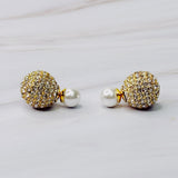 Shiny gold tone disco ball earrings with an elegant pearl back detail, adding a fun yet classy twist to your party look.