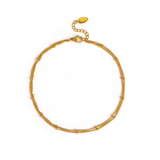 Gold bracelet on a white background